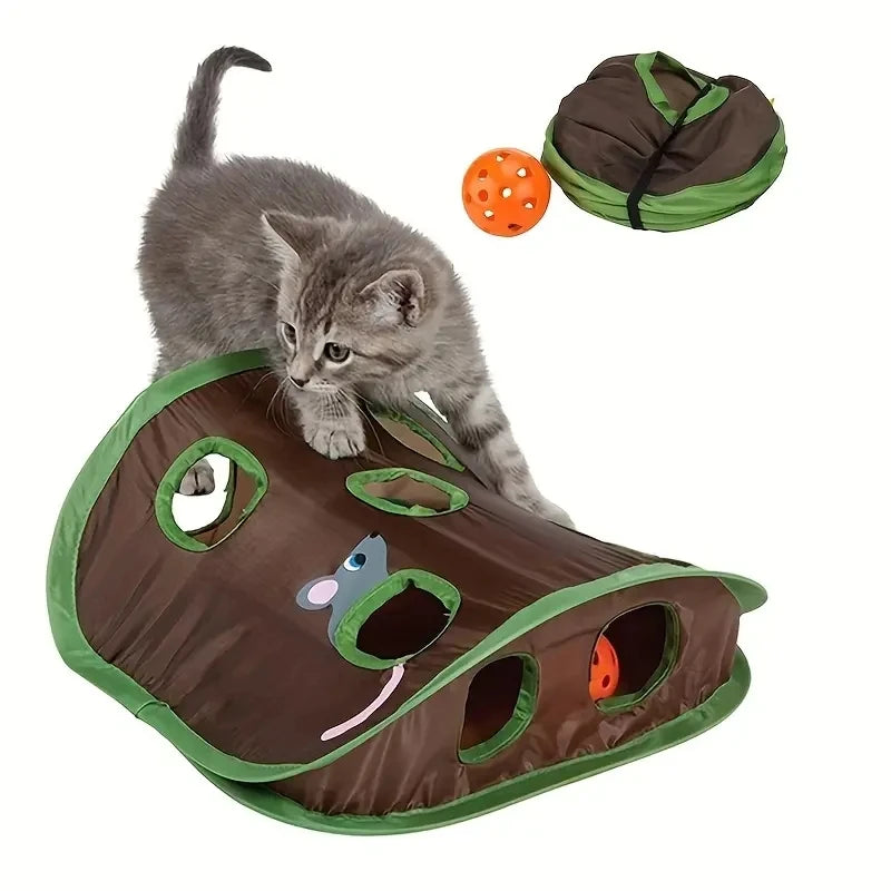 A gray cat with a collapsible 9-hole cat tunnel. The tunnel is made of fabric with various colored cut-outs and a plastic bottle cap for hiding treats.