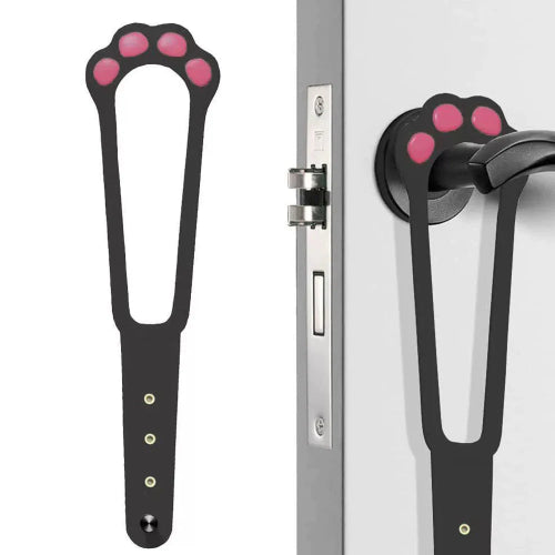 An adjustable cat door latch with a design resembling a cat's paw, shown in two color variations (black with pink paw prints and white with pink paw prints). The product is displayed in use on a door with a dog looking through the latch and a cat waiting outside.