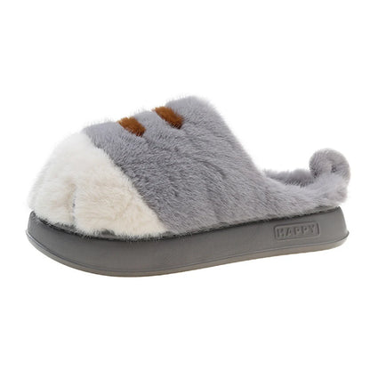 A plush home slipper with a cat paw design, featuring a combination of gray, white, and brown colors with a flat sole.