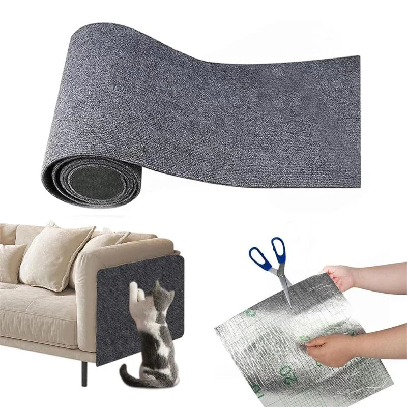 A gray cat scratching mat being placed on a sofa with a person holding it down while a cat sits and looks on.
