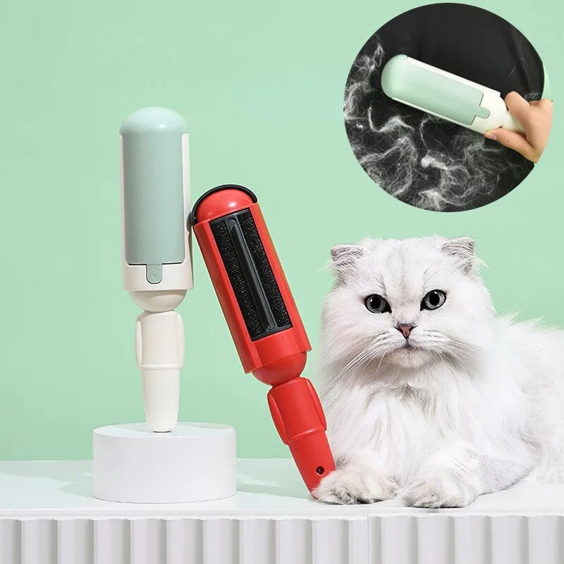 A red and white electrostatic cat hair remover brush is displayed with a white cat sitting next to it on a green surface. There's an inset image showing the brush's electrostatic feature.