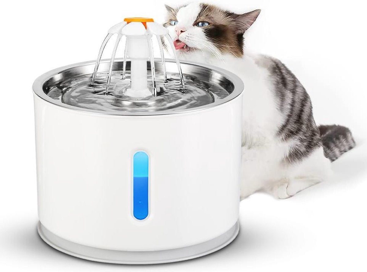 A white FelineFlow water dispenser flower with a cat drinking water from it.