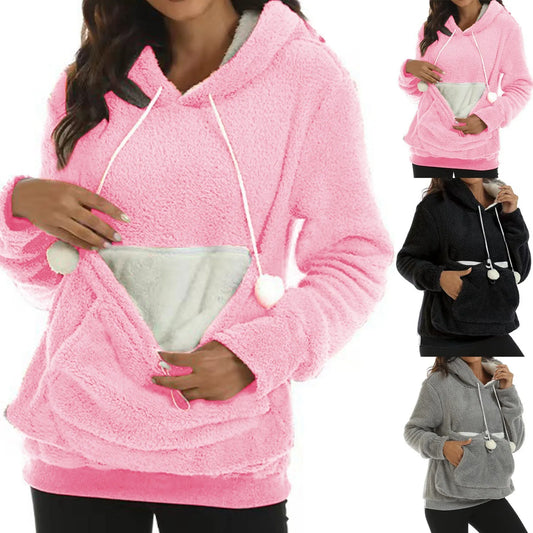 A collage of images showing a fleece pet carrier hoodie in pink and gray colors, with a built-in pouch for carrying a small pet. The hoodie is modeled by a person.