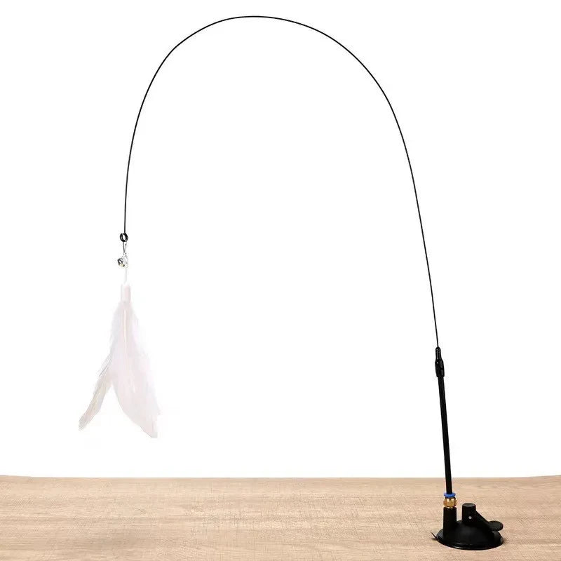 A black interactive cat feather wand toy with a detachable white feather attachment and a suction cup base.