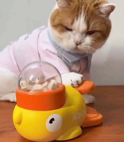 GIF of interactive cat toy feeder