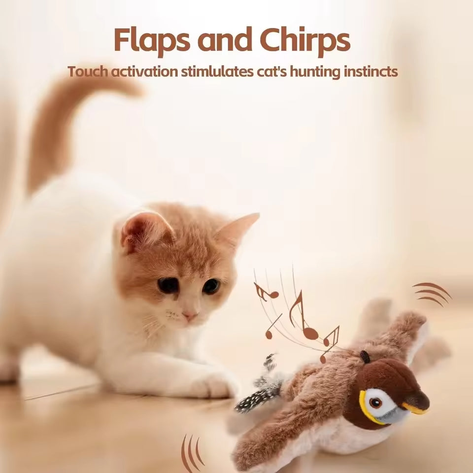 A white cat looking at a interactive flying bird toy with realistic wings flapping and chirping sounds.