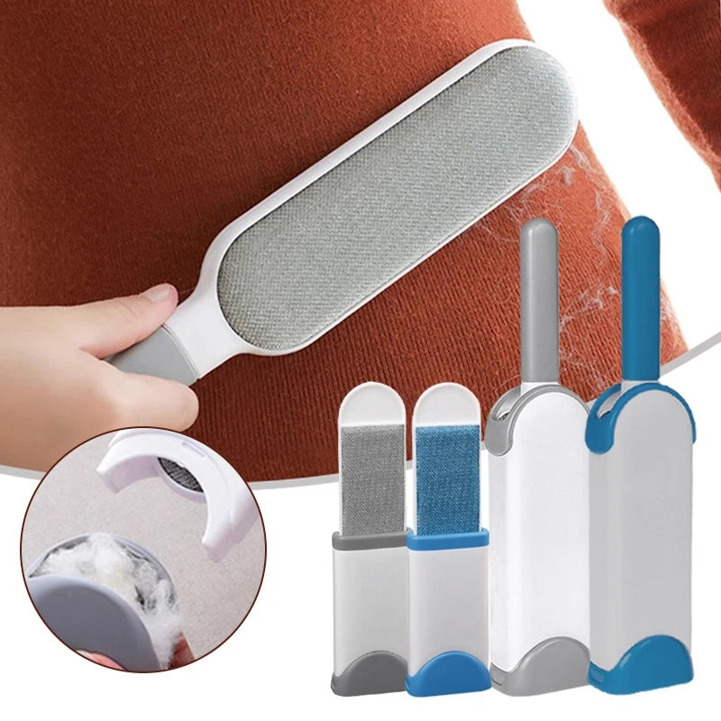 A lint roller with a white handle and a grey roller head, shown being used to remove lint and fur from a person's sweater. There are additional rollers with different colored attachments displayed beside it.