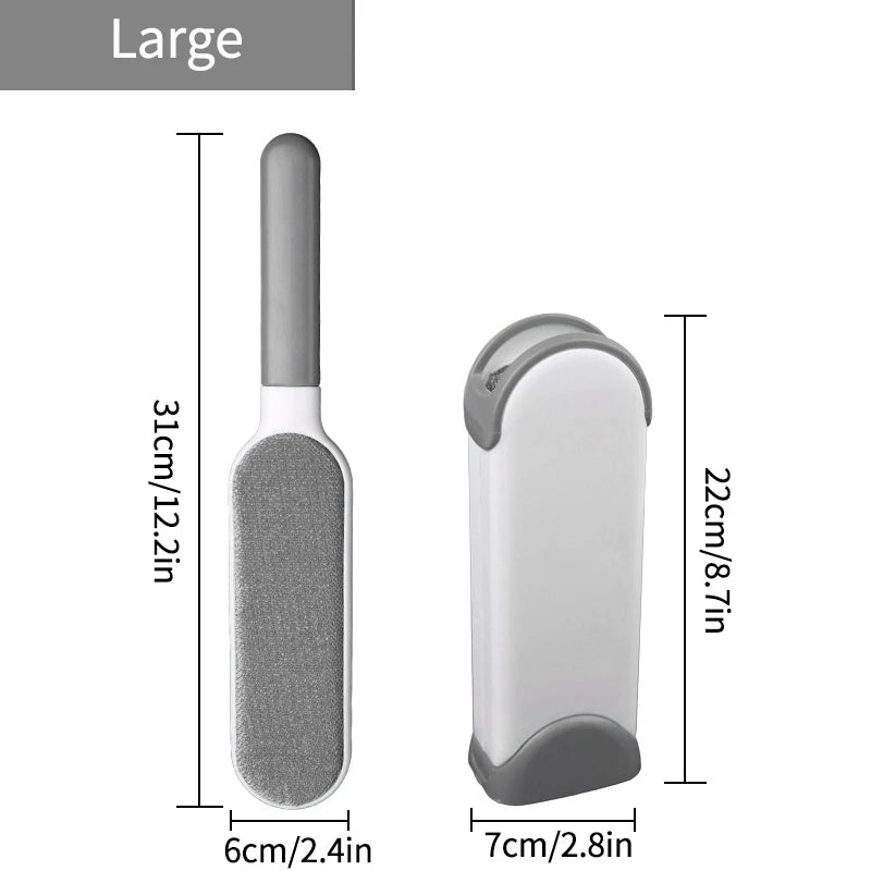 A lint roller with a white handle and a grey roller head, shown being used to remove lint and fur from a person's sweater. There are additional rollers with different colored attachments displayed beside it.