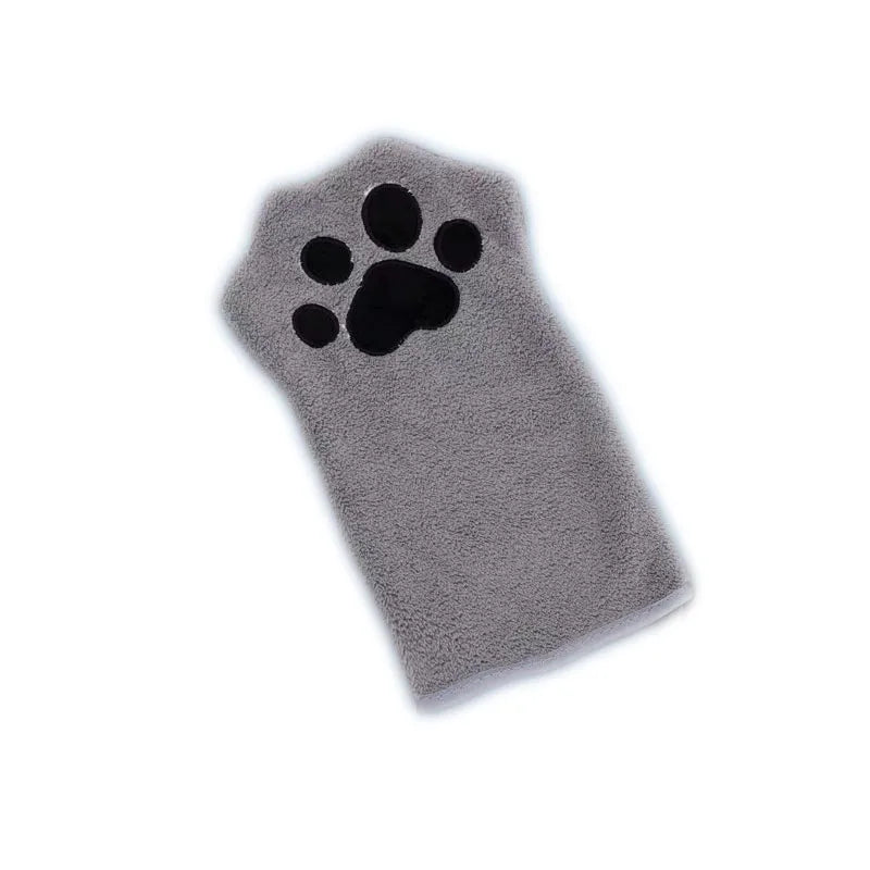 A gray microfiber pet grooming glove with a paw print design on one side.