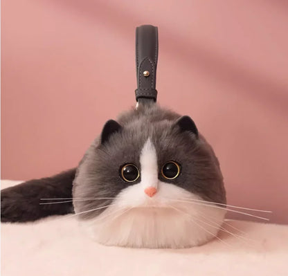 A plush toy resembling a cat with a one-shoulder bag design, featuring a soft gray and white color palette.