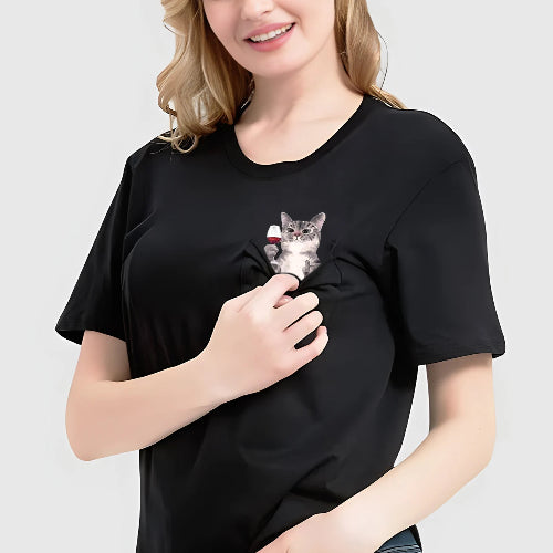 Woman wearing a black t-shirt with a cat graphic on a plain background