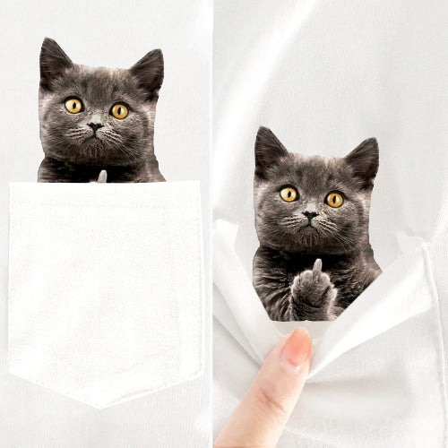 Two gray cats peeking out from behind a white sheet with a hand holding it open.