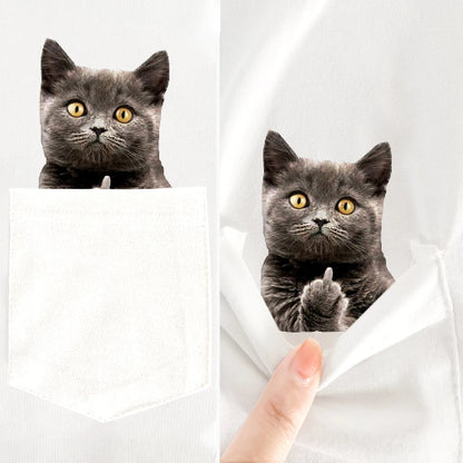 Two gray cats peeking out from behind a white sheet with a hand holding it open.