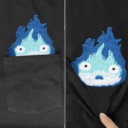 Black t-shirt with a blue and white embroidered design on the chest pocket.