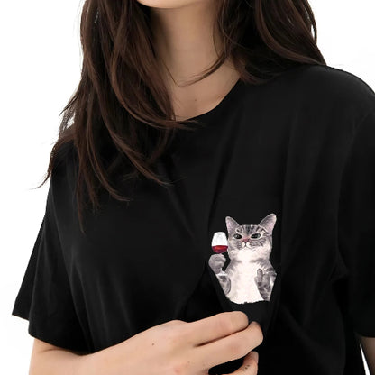 Person wearing a black t-shirt with a cat graphic on a white background
