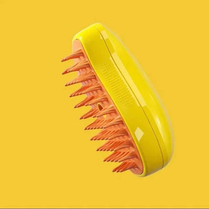 A yellow and pink spray & groom brush for cats, with the brush part facing up on a yellow background.