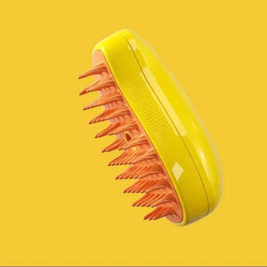A yellow and pink spray & groom brush for cats, with the brush part facing up on a yellow background.