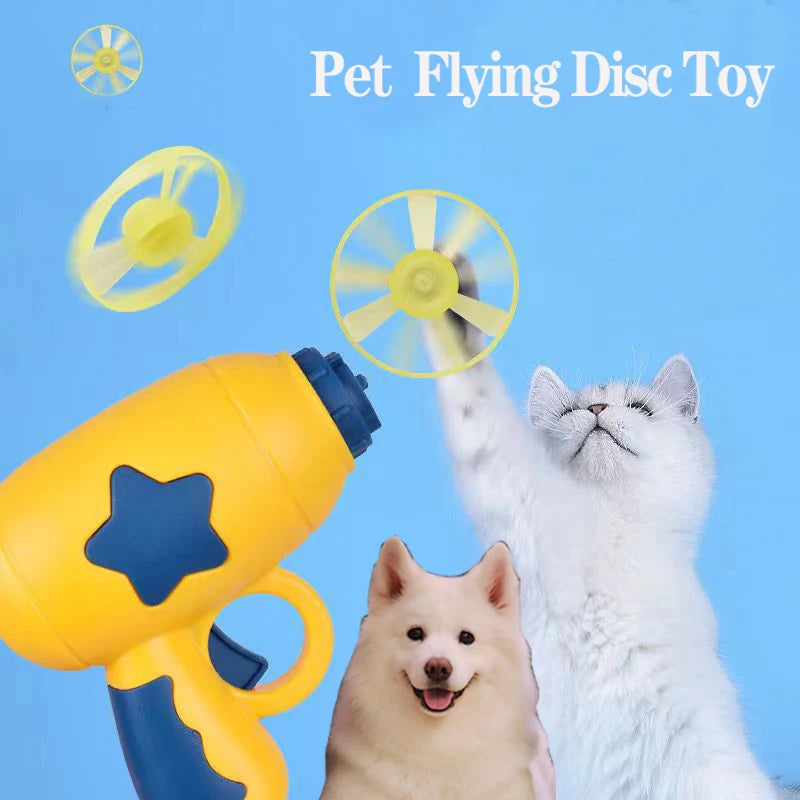 A cat toy called 'Pet Flying Disc Toy' with a yellow and blue gun-shaped launcher and a white dog-like figure chasing after a spinning blue disc toy.