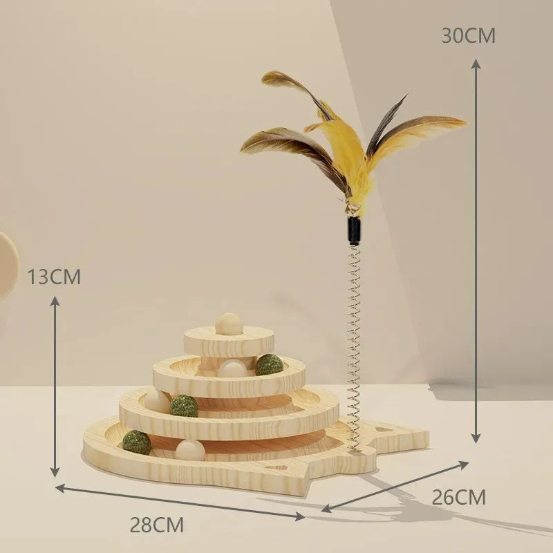 A wooden cat toy tower with triple-level platforms and a central vertical pole, topped with a large feather. The toy is designed with smooth-turning tracks with ball toys on the upper part.