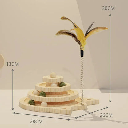 A wooden cat toy tower with triple-level platforms and a central vertical pole, topped with a large feather. The toy is designed with smooth-turning tracks with ball toys on the upper part.