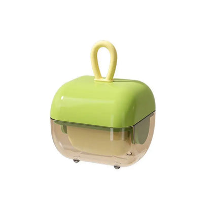 A green and clear washable pet hair and lint remover with a sticky roller ball on a white background.