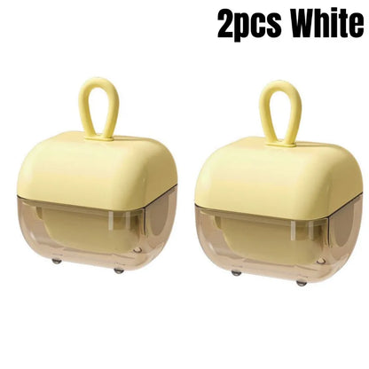 Two pieces of white washable pet hair and lint remover devices with sticky roller balls, designed for picking up pet hair and lint.